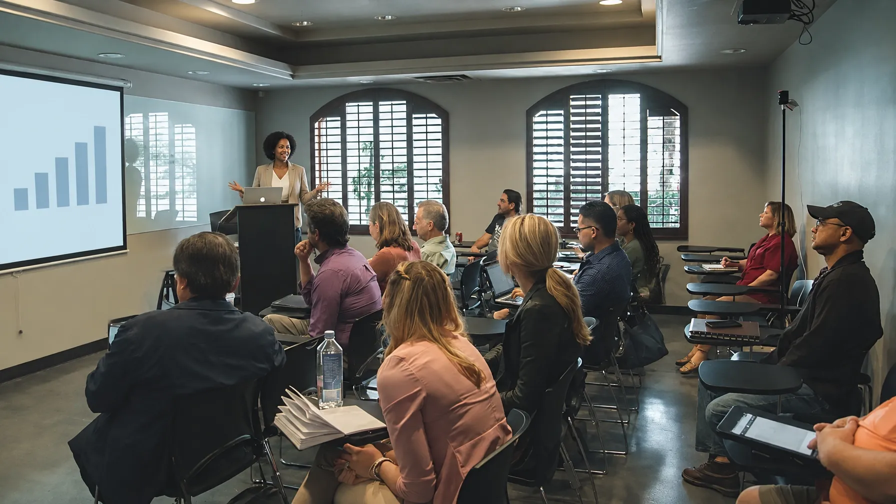 Woman teaching a group about retirement planning